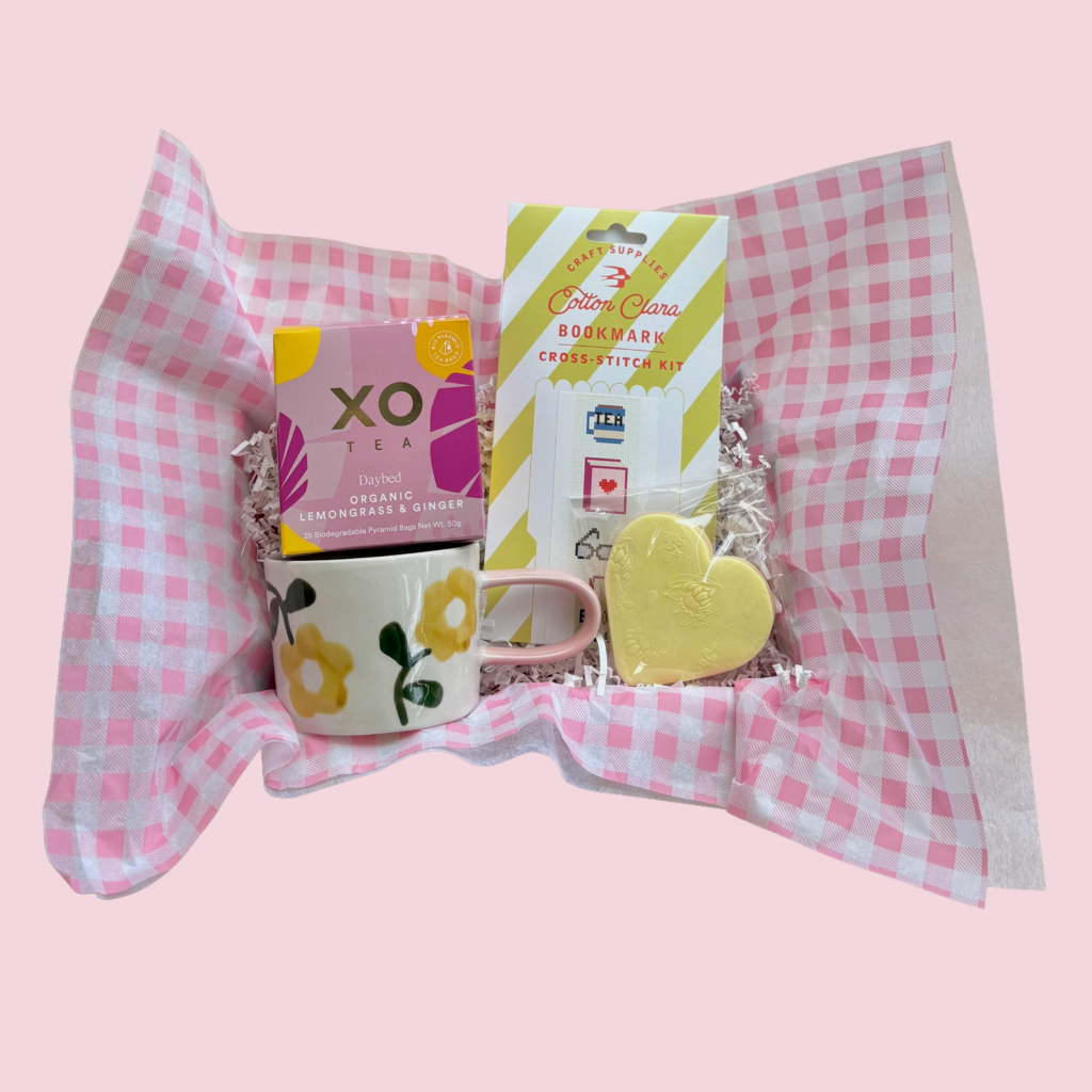 Book Club Mother's Day Hamper Perth. Cross stitch bookmark kit. XO tea 'Daybed' lemongrass and ginger tea. Caroline Gardner Ceramic Mug Mustard Flower. Home made cookie. Mother's Day Hamper Delivery Perth.